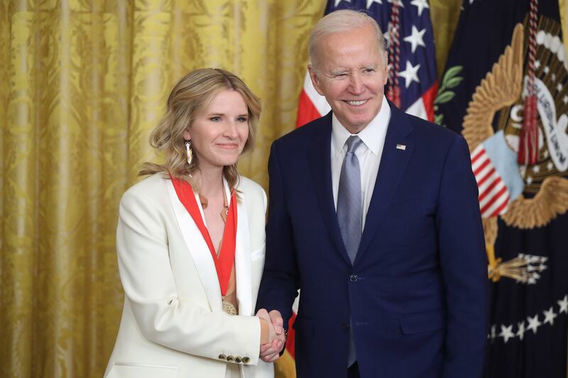 Mr Biden presents author Tara Westover with the National Humanities Medal. EPA