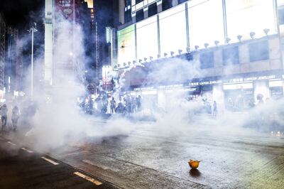 Demonstrators stand in a cloud of tear gas on Hennessy Road during a protest in the Causeway Bay district of Hong Kong, China, on Saturday, Aug. 31, 2019. Tens of thousands of Hong Kong protesters defied a police ban and marched peacefully through the city streets after several top opposition figures including Joshua Wong were arrested on Friday. Photographer: Justin Chin/Bloomberg