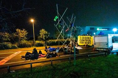 Extinction Rebellion activists blocking the entrance to the News Corporation newpaper printers at Broxbourne, Hertforedshire. Extinction Rebellion/AFP