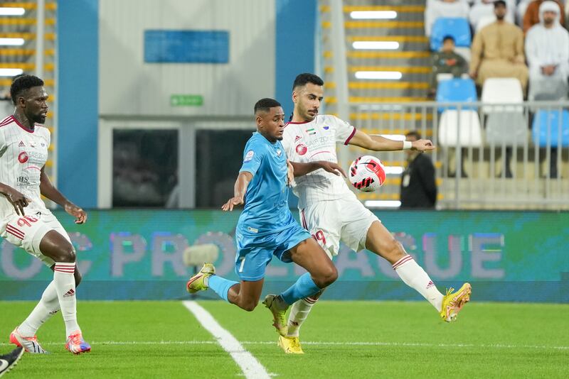 Khaled Al Dhahnani, right, who scored the opening goal in Sharjah’s 2-0 win, is challenged by Dibba's Jaja Silva in the Adnoc Pro League at Dibba Stadium on Sunday, December 25, 2022. Photo: PLC