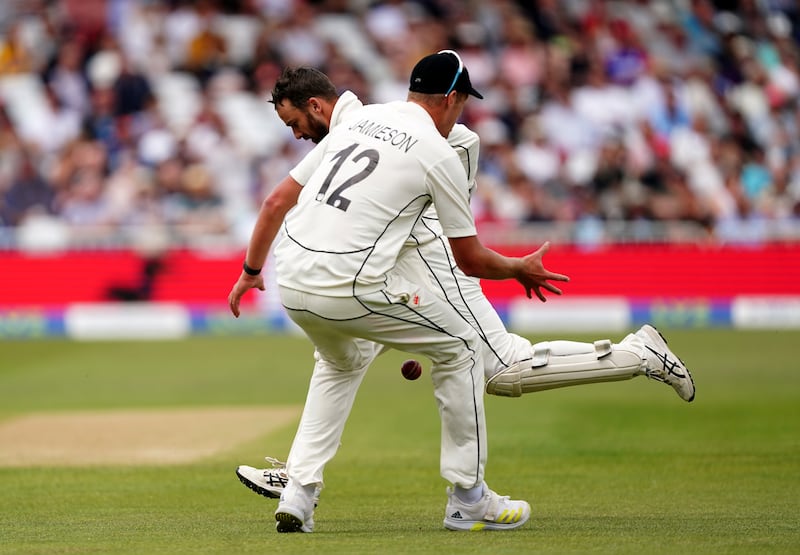 New Zealand's Kyle Jamieson and Tom Blundell fail to catch a tough chance of Joe Root. PA