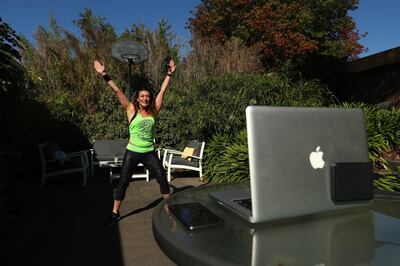 MELBOURNE, AUSTRALIA - APRIL 09: Julia Basa leads an online PILOXING session from her backyard on April 09, 2020 in Melbourne, Australia. PILOXING is a non-stop, cardio workout which combines standing pilates, boxing and dance. With gyms and indoor exercise facilities now closed and outdoor fitness classes restricted to two people due to the COVID-19 pandemic, Australians are finding ways to maintain their fitness at home and in ways that respect social distancing rules.  (Photo by Robert Cianflone/Getty Images)