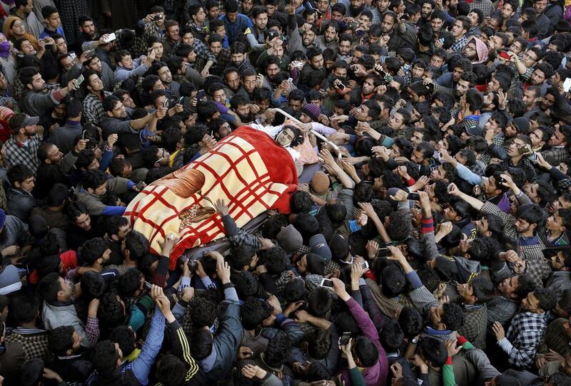 Kashmiri Muslim villagers carry the body of Dawood Ahmad Sheikh, a suspected rebel of Hizbul Mujahedeen, during his funeral procession in Kaimuh.  Mukhtar Khan / AP Photo