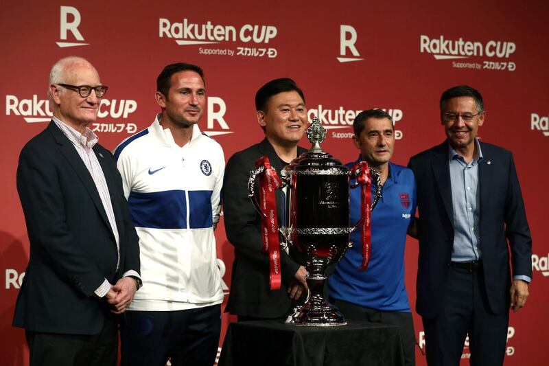 From left: Chelsea chairman Bruce Buck, manager Frank Lampard, Japanese Rakuten company president and CEO Hiroshi Mikitani, Barcelona manager Ernesto Valverde and president of FC Barcelona Josep Maria Bartomeu pose with the Rakuten Cup. AFP