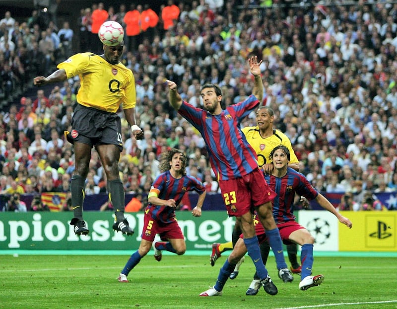 PARIS - MAY 17:  Sol Campbell (R) of Arsenal rises above Presas Oleguer of Barcelona to score the first goal  during the UEFA Champions League Final between Arsenal and Barcelona at the Stade de France on May 17, 2006 in Paris, France.  (Photo by Laurence Griffiths/Getty Images)