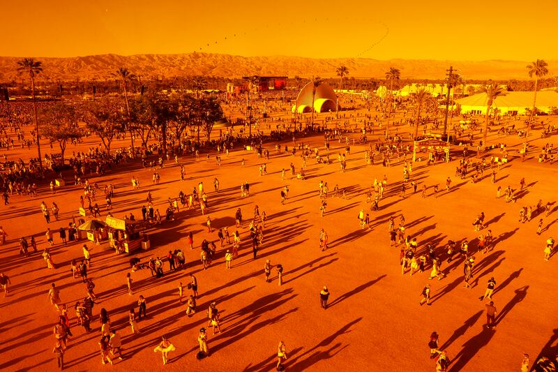 Attendees are seen through the ‘Spectra’ art installation during the Coachella Valley Music and Arts Festival in Indio, California. EPA