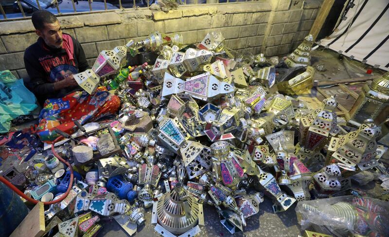 An Egyptian craftsman makes traditional Ramadan lanterns, called Fanous, at a workshop in the capital city of Cairo. EPA