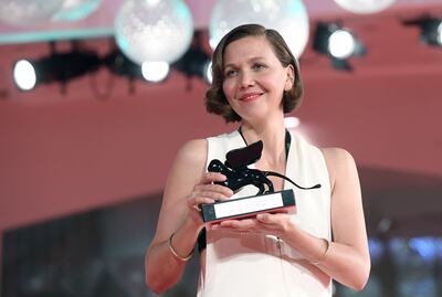 Maggie Gyllenhaal with her award for Best Screenplay for 'The Lost Daughter'. EPA