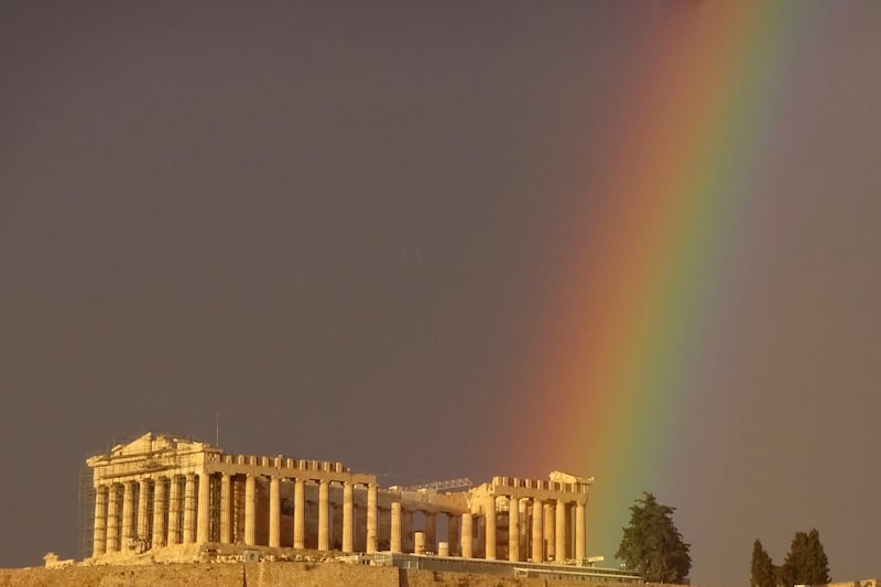 A rainbow arcs over the ancient Acropolis, brightening up a gloomy sky in Athens. AP
