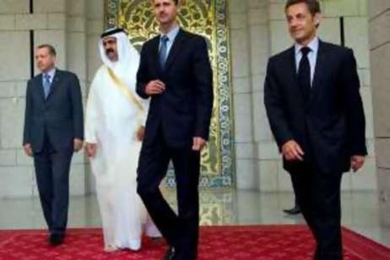 French President Nicolas Sarkozy, Syria's President Bashar Assad, the Emir of Qatar Sheik Hamad bin Khalifa Al Thani and Turkish Prime Minister Recep Tayyip Erdogan, from right, walk together at the end of a summit in Damascus, Thursday, Sept. 4, 2008. Sarkozy encouraged Syria to pursue face-to-face peace talks with Israel during his first trip  to the Arab nation. (AP Photo/Philippe Wojazer, Pool)  *** Local Caption ***  PAR102_Syria_France.jpg