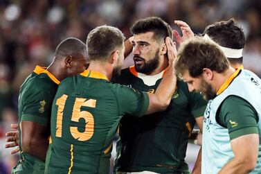 Damian de Allende is congratulated by teammates after scoring a try during the Rugby World Cup 2019 semi-final against Wales. EPA