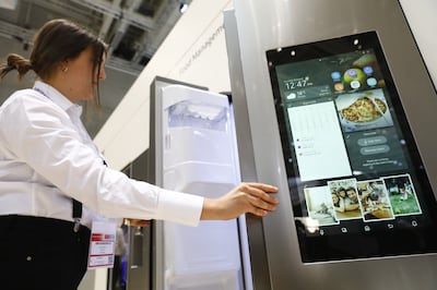 Visitors look at the Samsung Home appliance smart Fridge at a trade in Berlin, Germany. Through the Energy Bill legislation, the UK government hopes smart appliances will become the norm in UK households. (Photo by Michele Tantussi/Getty Images)