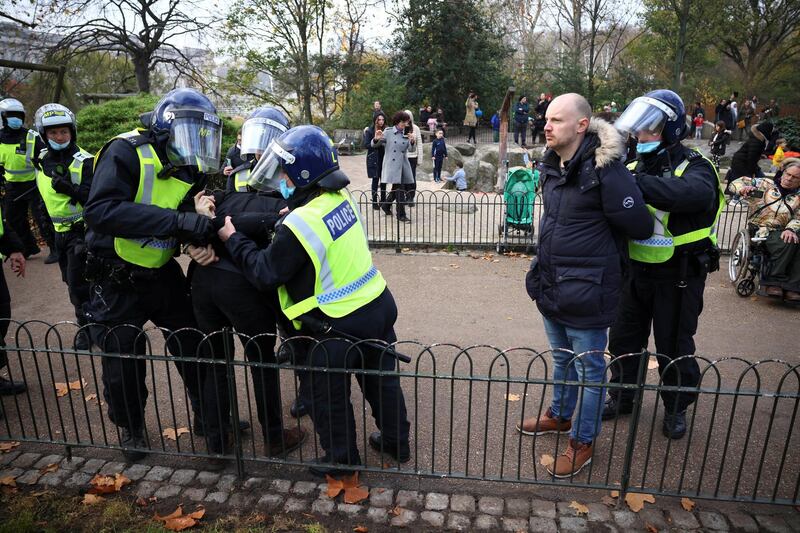 Police officers detain protestors during an anti-lockdown demonstration amid the coronavirus disease (COVID-19) outbreak in London.  Reuters