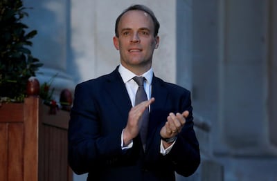 LONDON, ENGLAND - APRIL 09: Britain's Secretary of State for Foreign Affairs Dominic Raab applauds during the Clap For Our Carers campaign in support of the NHS, as the spread of the coronavirus disease (COVID-19) continues outside the Foreign Office on April 9, 2020 in London, England. There have been over 60,000 reported cases of the COVID-19 coronavirus in the United Kingdom and 7,000 deaths. The country is in its third week of lockdown measures aimed at slowing the spread of the virus. (Photo by Henry Nicholls - WPA Pool/Getty Images)