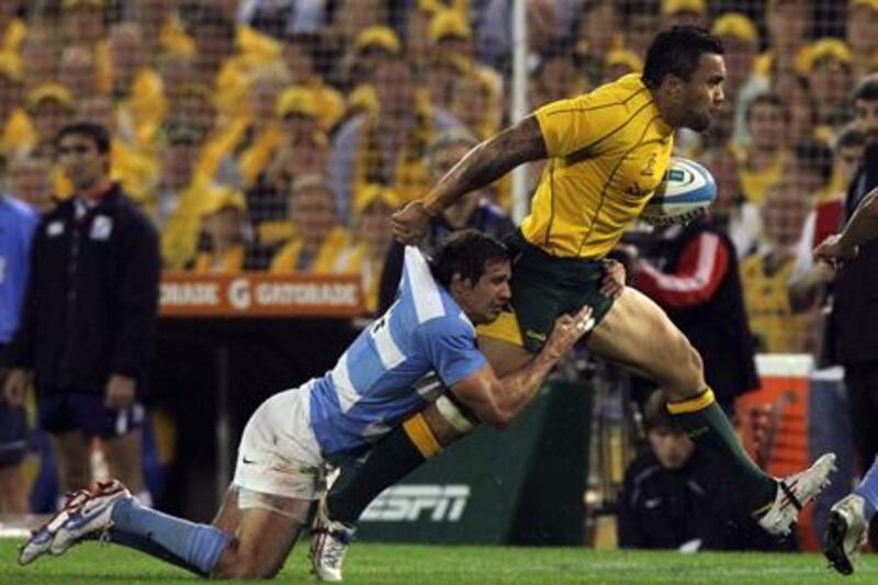 Argentina's Marcelo Bosch tries to bring down Australia's Ben Tapuai during their Rugby Championship encounter.