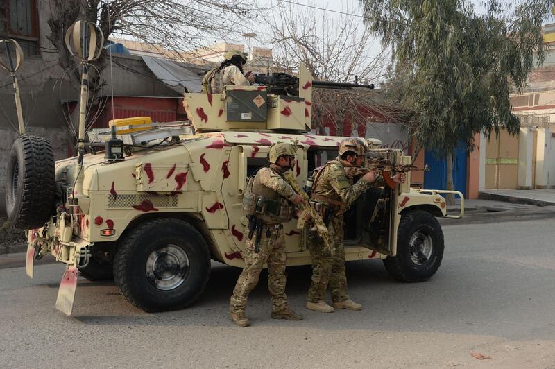 Afghan army soldiers outside the compound. Noorullah Shirzada / AFP Photo