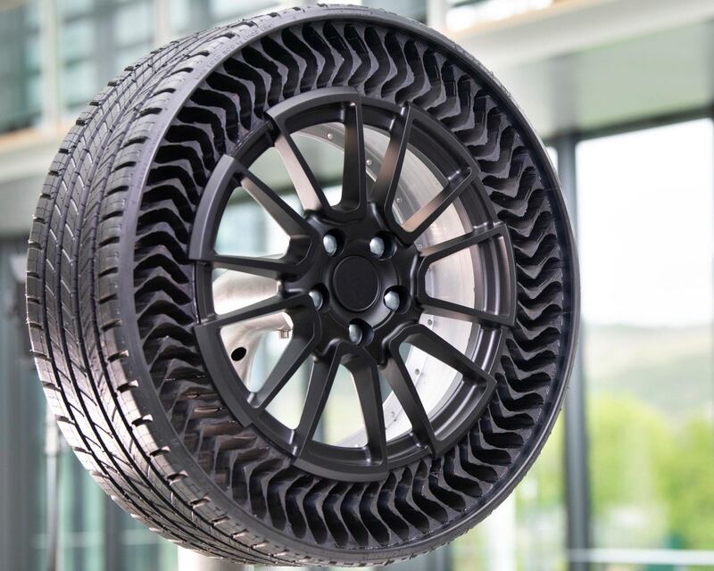 It is made from a combination of rubber for the tread, aluminium for the embedded wheel and a new reinforcing material comprising resin-embedded fibreglass for the 70 spokes that provide the shock absorbing properties instead of air. Courtesy Michelin
