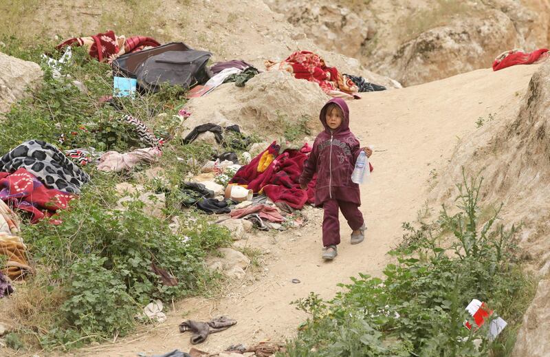 A girl walks in the village of Baghouz, Der Ezzor province, Syria. Reuters