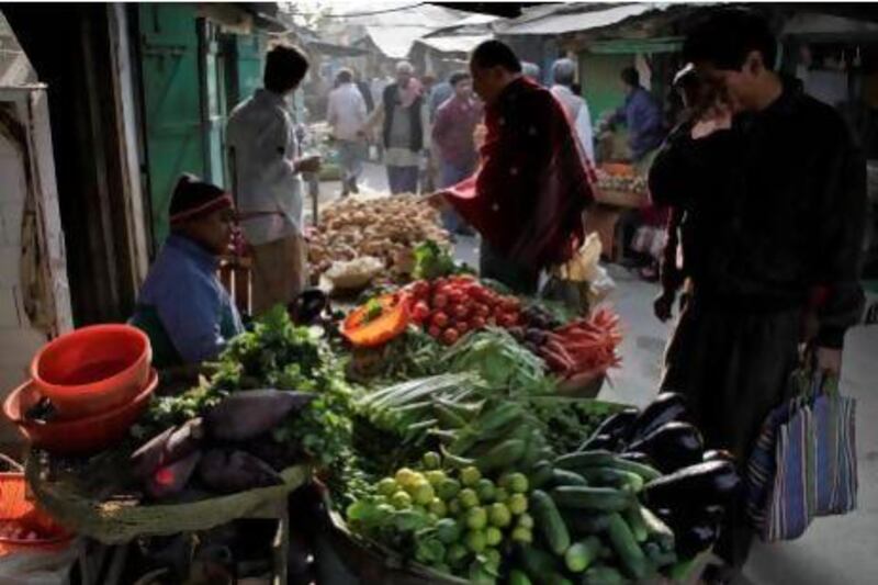 A vegetable market in Calcutta, India, where heavy rains have stifled the supply of fruit and vegetables and caused prices to skyrocket.