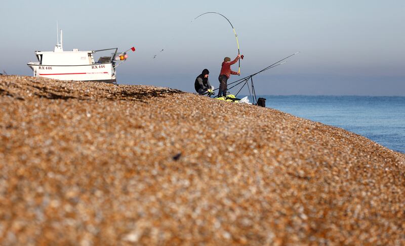 A fisherman casts out in Dungeness, south-east England. Reuters