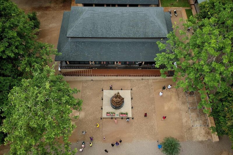 This aerial picture shows visitors exploring the visitor centre for the Tham Luang cave.  AFP
