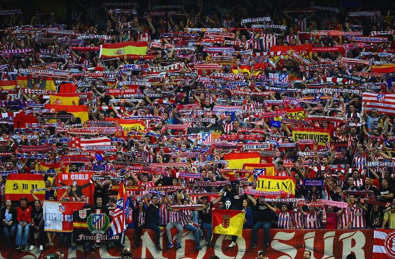 Atletico Madrid fans show their colours during the Champions League victory over FC Barcelona on Wednesday. Laurence Griffiths / Getty Images / April 9, 2014