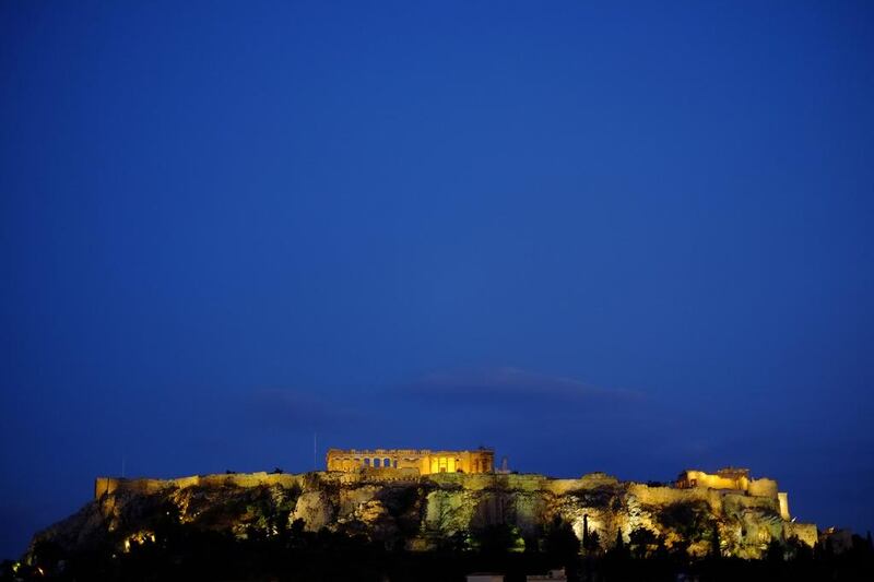 The ancient Acropolis hill, with the ruins of the fifth century BC Parthenon temple, is seen after sunset in central Athens. Petros Karadjias / AP Photo