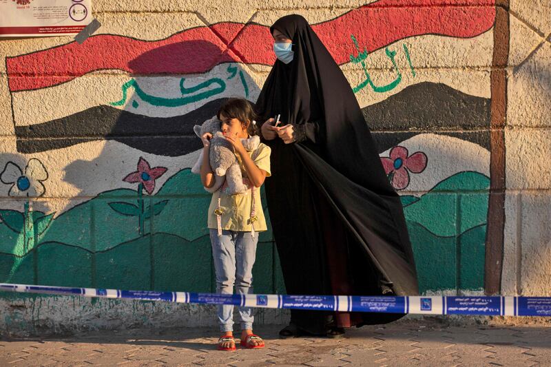 An Iraqi woman and her daughter outside a polling station in Basra, on October 10, during the country's parliamentary elections. The results were confirmed on Monday. AFP