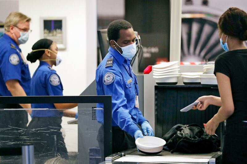 Passengers must undergo must more stringent checks than before 9/11. AP