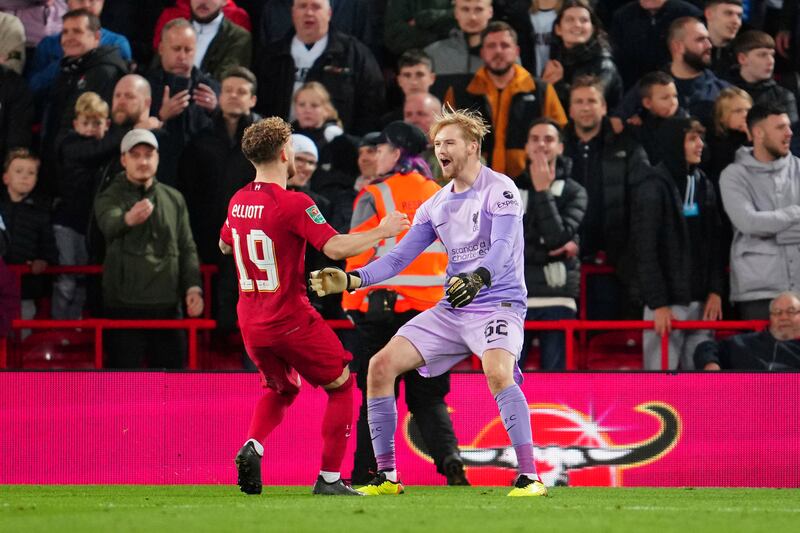 Liverpool goalkeeper Caoimhin Kelleher, right, celebrates with teammate Harvey Elliott after the English League Cup soccer match between Liverpool and Derby County, at Anfield Stadium, in Liverpool, England, Wednesday Nov.  9, 2022.  (AP Photo / Jon Super)