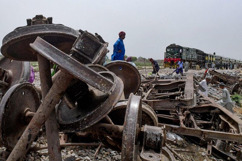 Damaged tracks are repaired a day after the derailment of a passenger train in Nawabshah, Pakistan. AFP