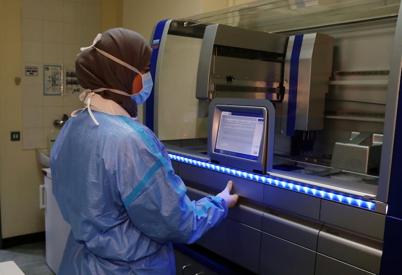 A medical staff works inside a lab for analysing the coronavirus tests, at Rafik Hariri University Hospital, in Beirut, Lebanon. REUTERS
