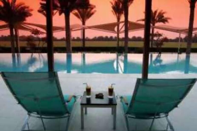 Dubai Desert Palm Hotel. Courtesy Per Aquum

REF al23oc-DesertPalm 23/10/08 *** Local Caption ***  Pool_gar_8.jpg