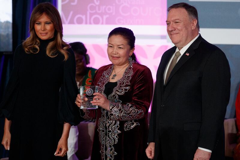 Sayragul Sauytbay, of China, nominated by Kazakhstan, receives her award from US First Lady Melania Trump and Secretary of State Mike Pompeo during the International Women of Courage Awards ceremony.  AP