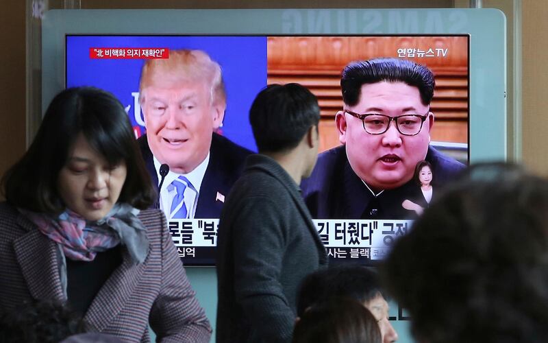 A man watches a TV screen showing file footage of U.S. President Donald Trump, left, and North Korean leader Kim Jong Un during a news program at the Seoul Railway Station in Seoul, South Korea, Monday, April 9, 2018. North Korea's government has communicated with the United States to say that leader Kim is ready to discuss his nuclear weapons program with Trump, officials said Sunday, increasing the likelihood that the unprecedented summit will actually occur. (AP Photo/Ahn Young-joon)