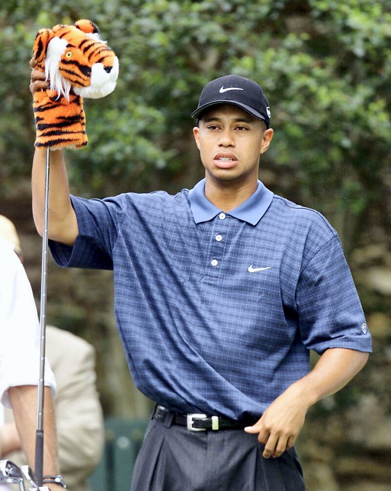 Tiger Woods of the US takes out his driver on the 2nd tee at the Augusta National Golf Club, 07 April 2001, during the 3rd round of the 2001 Masters golf tournament in Augusta, Georgia. Woods finished the round in 1st place at 12 under-par.   AFP PHOTO/Timothy A. CLARY (Photo by TIMOTHY A. CLARY / AFP)