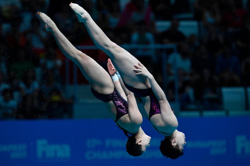 North Korea's Kim Mi Rae and Kim Kuk Hyang compete in the women's 10m platform synchronised diving final  in Budapest. Christopje SImon / AFP Photo