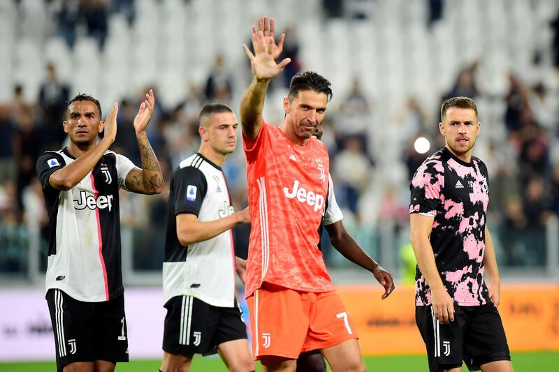 Juventus' Gianluigi Buffon, Danilo and Aaron Ramsey celebrate after the match. Reuters