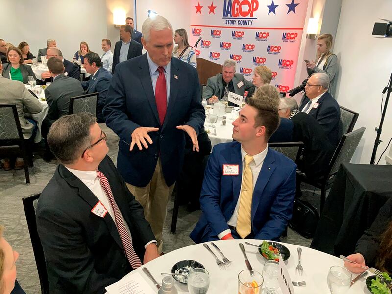 Former vice president Mike Pence chats with Republican activists at a Story County Republican fundraiser in Ames, Iowa. AP
