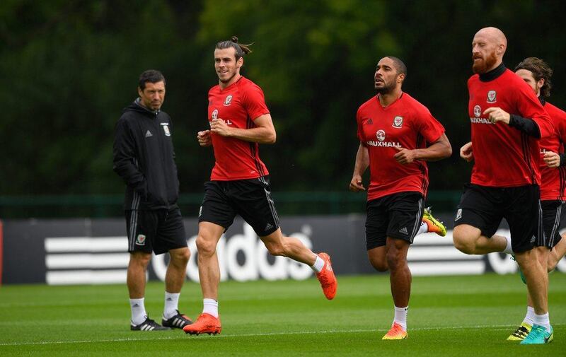 Wales players Gareth Bale, left, Ashley Williams and James Collins take part in training at the Hensol Vale in Cardiff on August 31, 2016. Stu Forster / Getty Images