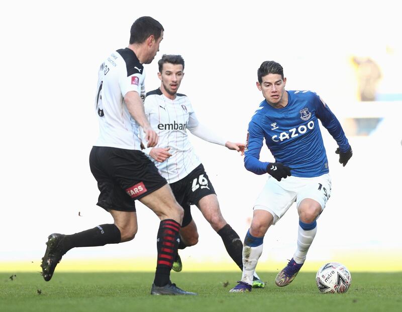 James Rodriguez closely watches by Rotherham's Richard Wood and Daniel Barlaser. Getty