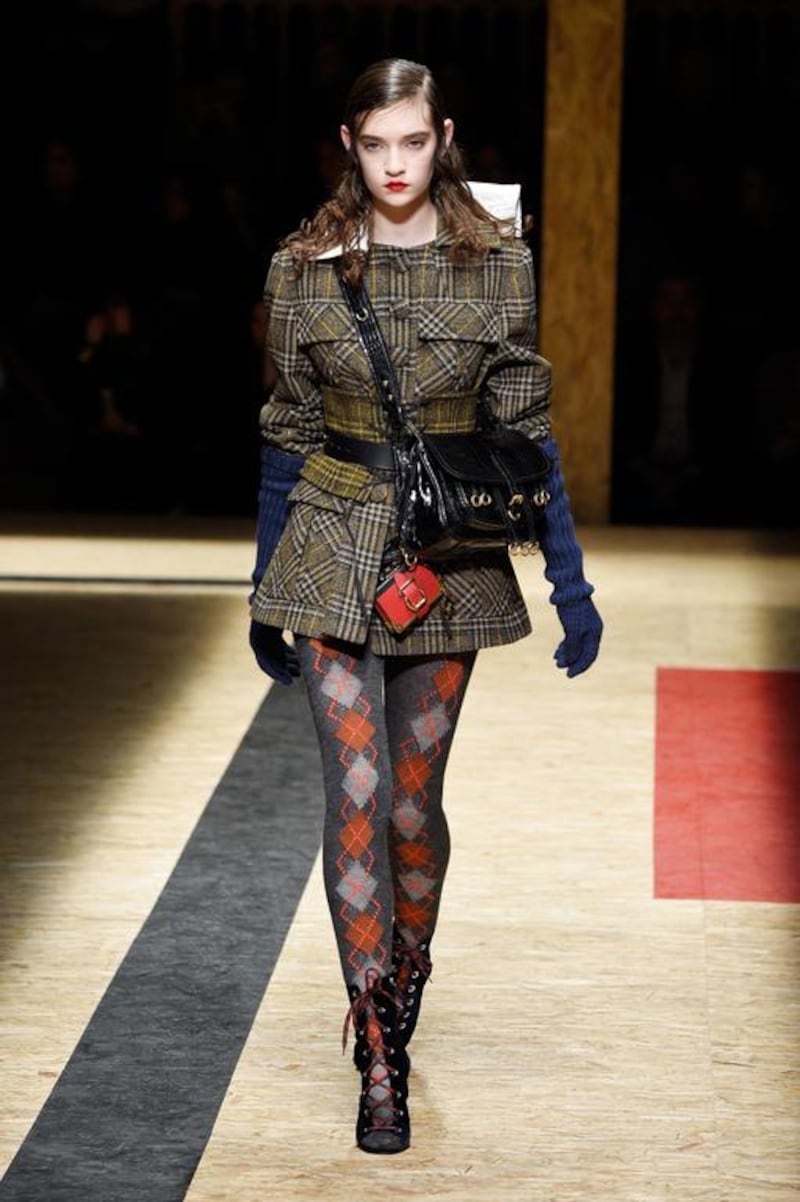 A model for Prada sports argyle tights while walking down the runway at Milan Fashion Week. Pietro D’aprano / Getty Images
