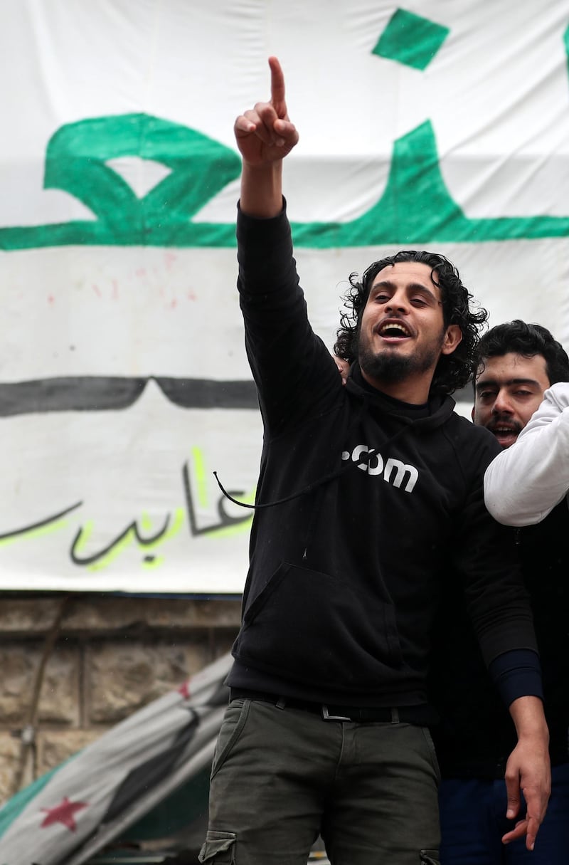 This picture taken on March 15, 2019, shows the late Syrian rebel fighter Abdel-Basset al-Sarout taking part in a rally to commemorate the beginning of the Syrian revoltion, in the town of Maaret al-Numan in the jihadist-held Idlib province. The Syrian goalkeeper turner rebel fighter who starred in an award-winning documentary died of his wounds today aged 27 after fighting regime forces in northwest Syria, a monitor and his faction said.
Al-Sarout was a goalkeeper from the central city of Homs, who became its most popular singer of protest songs after Syrian uprising broke out in March 2011. / AFP / OMAR HAJ KADOUR
