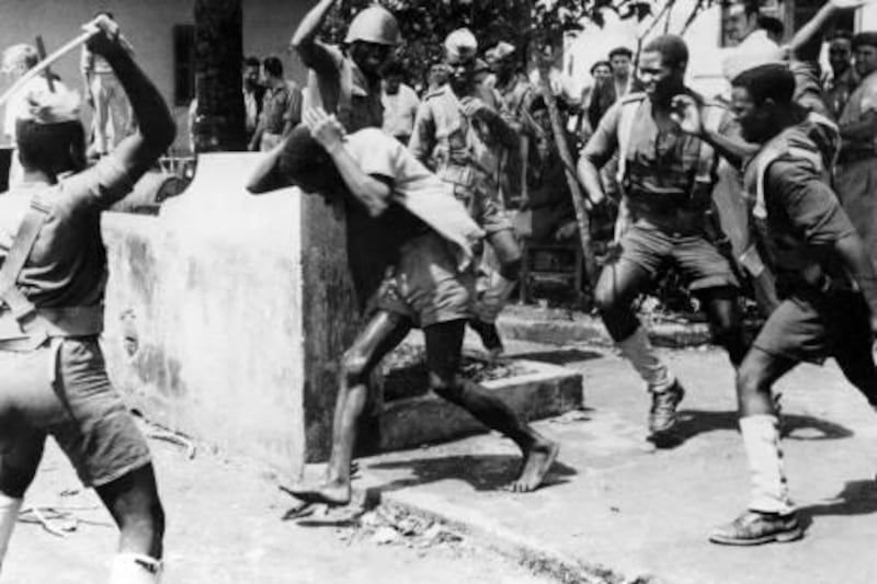 Angolan soldiers arrest a man suspected of being a liaison officer with foreign forces on April 4, 1961 in Quitexe during an uprising which started by an armed attack by a small group of MPLA (Popular Liberation Movement of Angola) against the San Joao prison, on February 4, 1961, in which several Angolan nationalists were held. Angola became independent from Portugal on November 11, 1975 after a 14-year revolt of nationalist movements against colonial army.
