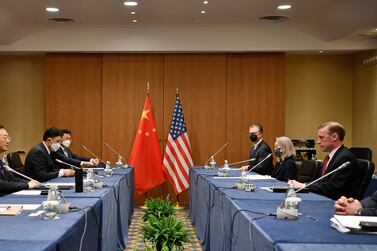 In this photo released by Xinhua News Agency Yang Jiechi, a member of the Political Bureau of the Communist Party of China (CPC) Central Committee and director of the Office of the Foreign Affairs Commission of the CPC Central Committee, at left meets with U. S.  National Security Advisor Jake Sullivan at right in Rome, Italy, March 14, 2022.  Face to face, President Joe Biden's national security adviser warned the top Chinese official on Monday about China's support for Russia in the Ukrainian invasion, even as the Kremlin denied reports it had requested Chinese military equipment to use in the war.  (Jin Mamengni / Xinhua via AP)