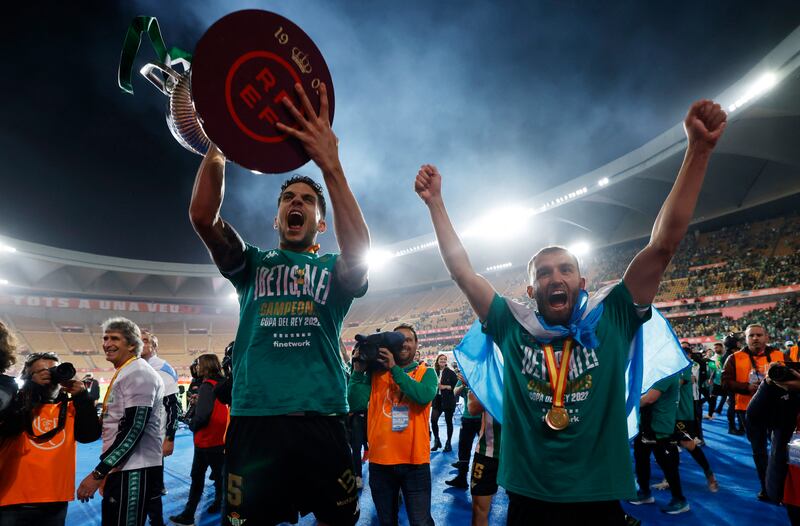 Real Betis defender Marc Bartra celebrates with German Pezzella after winning the Copa del Rey. Reuters