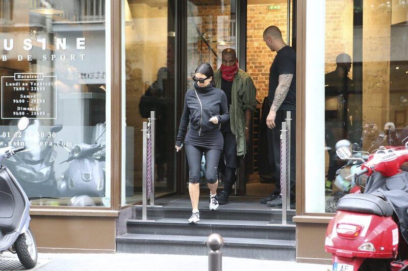 Kim Kardashian and rap singer Kanye West  leave a fitness center in Paris on May 21, 2014. The gates of the Chateau de Versailles, once the digs of Louis XIV, will be thrown open to Kim Kardashian, Kanye West and their guests for a private evening this week ahead of their marriage. Jacques Brinon / AP photos