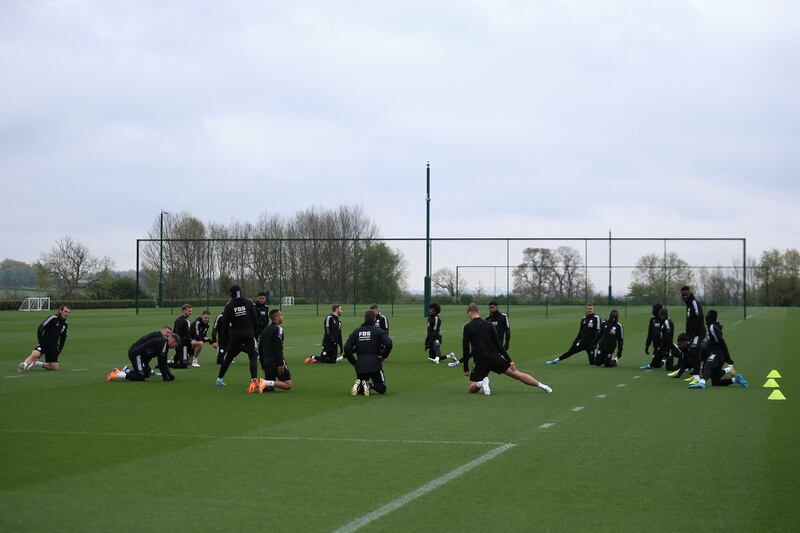 Leicester City players stretch during training ahead of the match against Roma. AFP