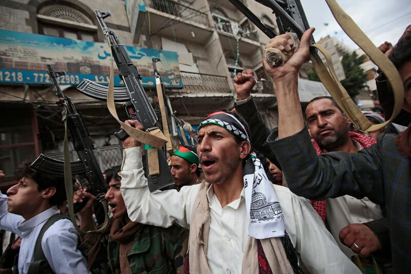 Houthi supporters hold their weapons as they chant slogans during a protest against Israeli attacks on Palestinians in Gaza, Monday, May 17, 2021, in Sanaa, Yemen.  (AP Photo/Hani Mohammed)