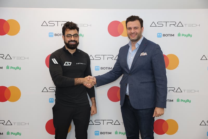 Abdallah Abu Sheikh, co-founder and chief executive of Astra Tech, and J.K. Khalil, cluster general manager for Mena East at Mastercard, during the signing ceremony between the two companies. Photo: Astra Tech